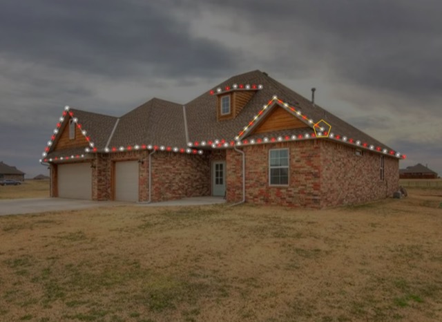 The same home mocked up with red and white Christmas lights